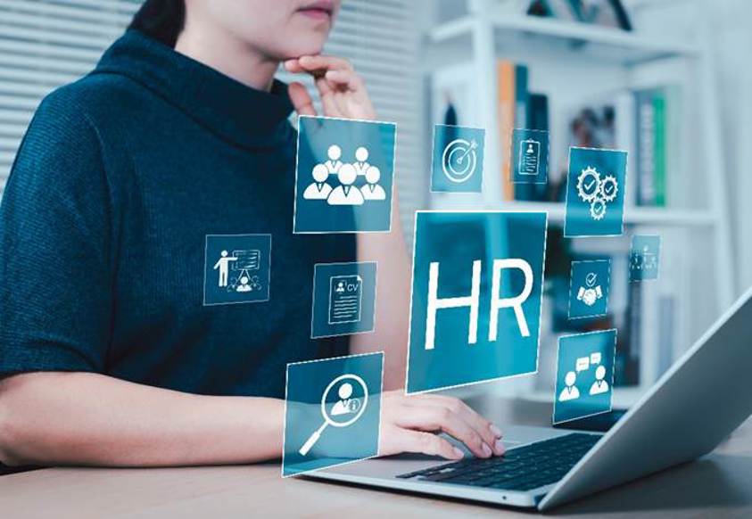 A person sitting at a desk using a computer
AI-generated content may be incorrect.